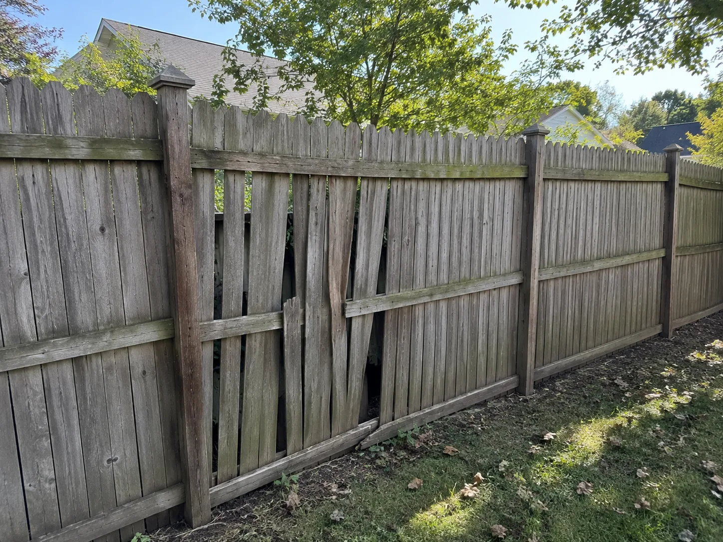 Old wood fence in poor condition before removal